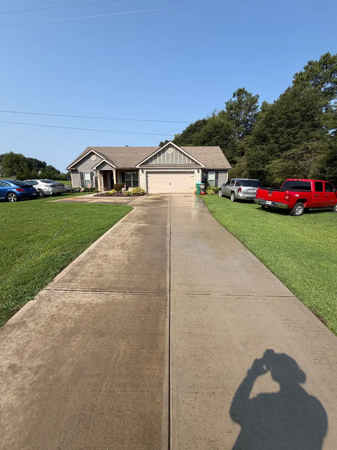 Concrete walkway leading from the street to a residential home