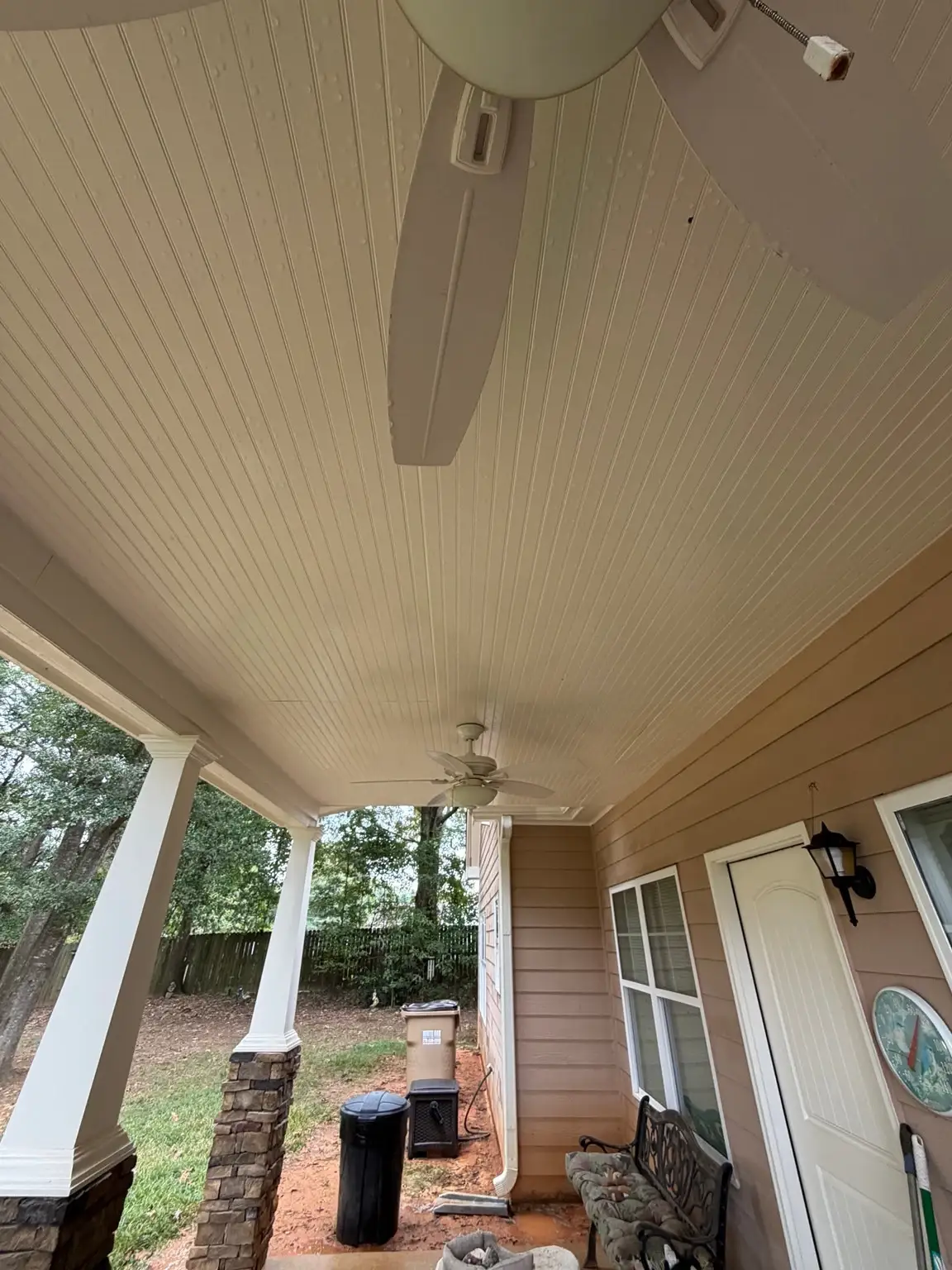 Covered porch ceiling in Auburn after softwashing
