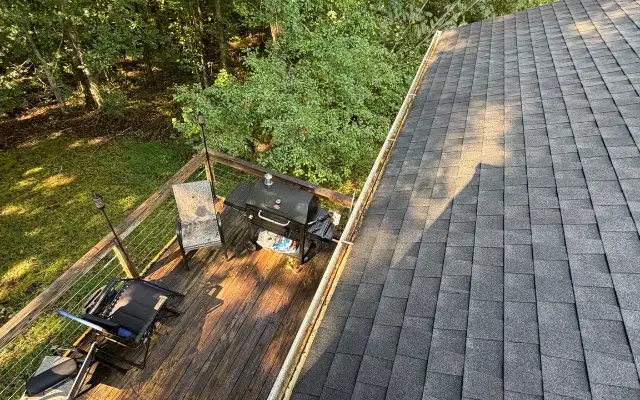 The same gutter above the deck in Winder cleared of heavy debris and plants