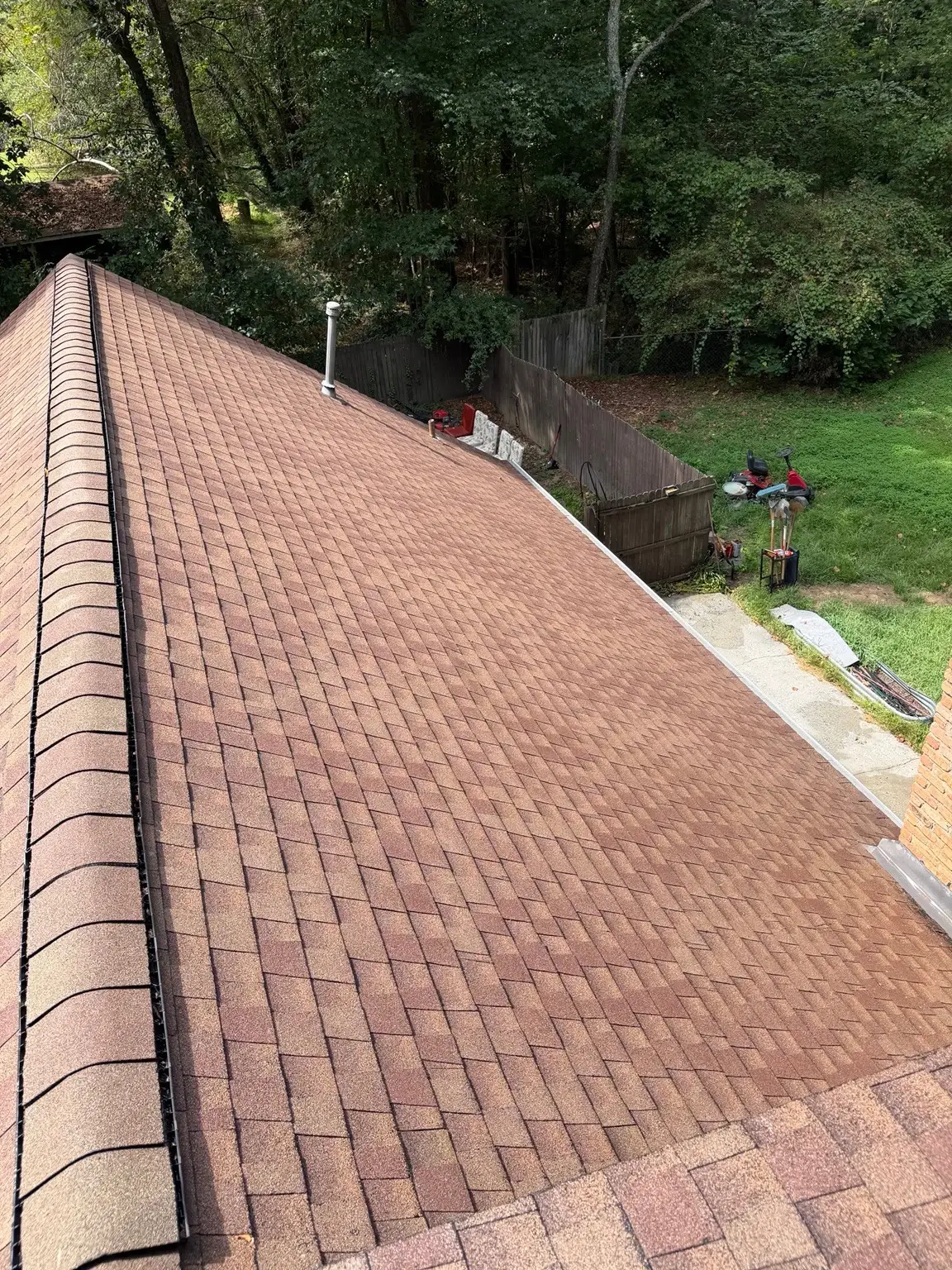 The same shingle roof section beside the chimney in Winder after washing