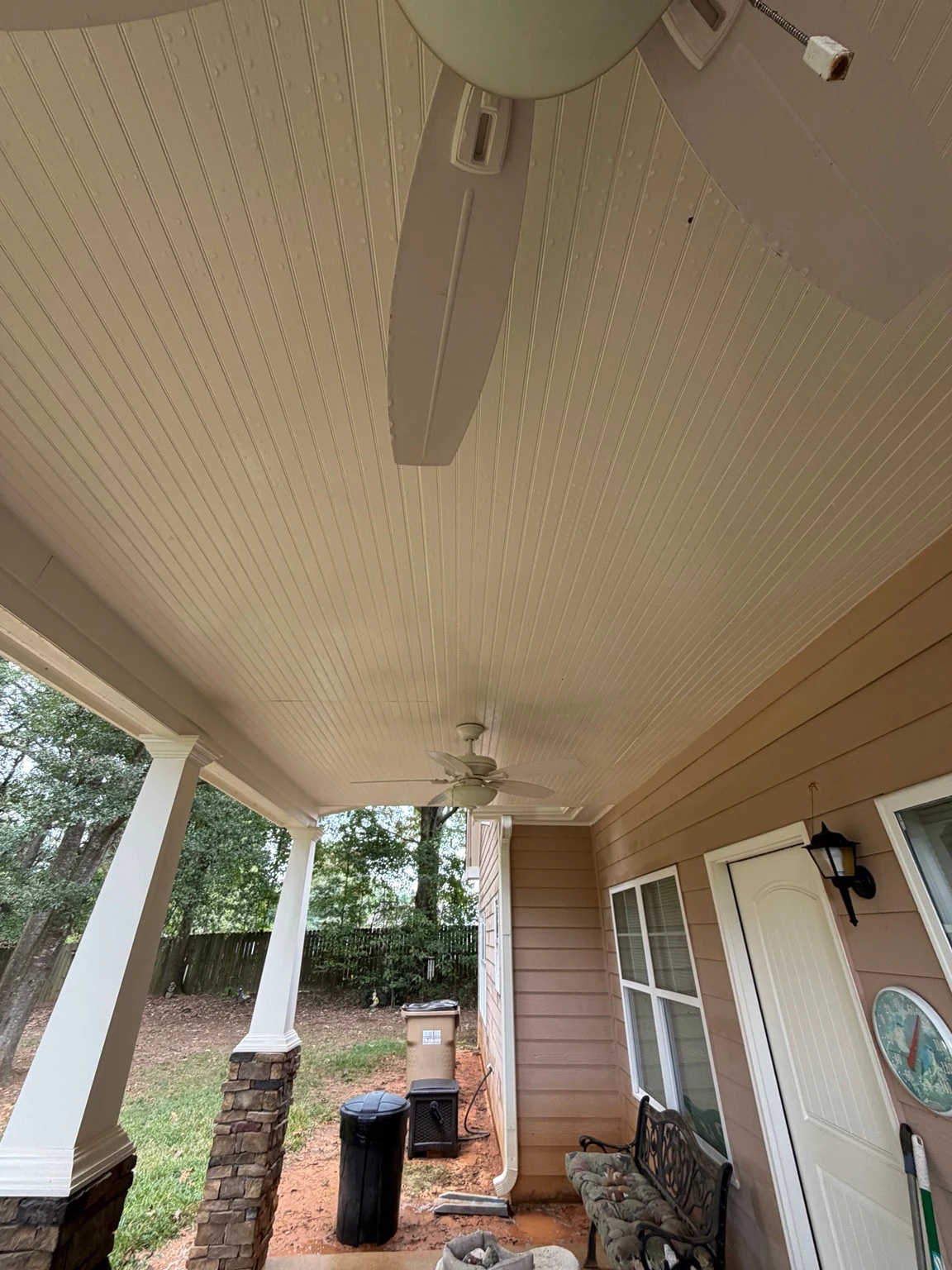 Covered porch ceiling in Auburn after softwashing