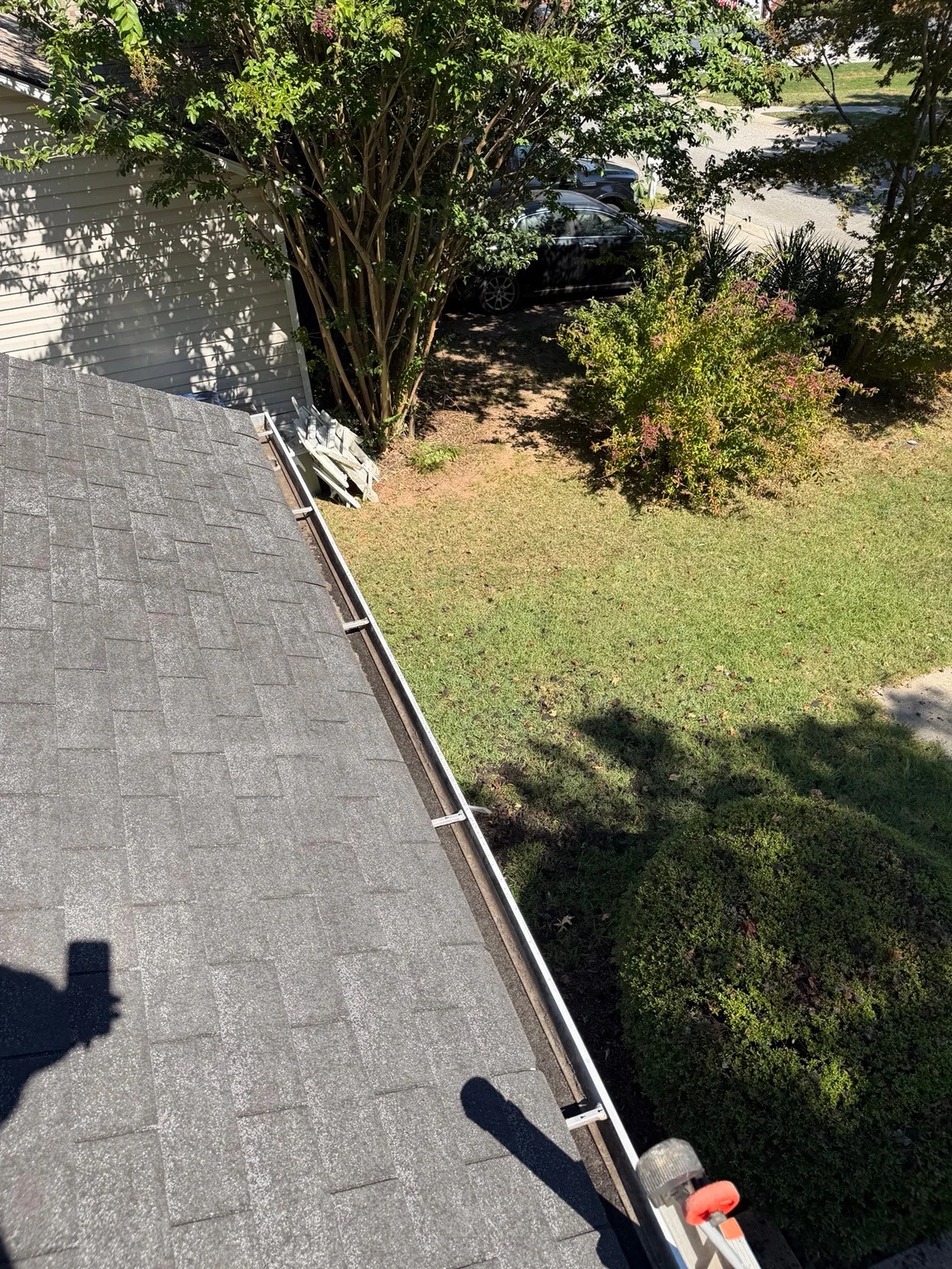 The same gutter at a Winder home visibly cleared after cleaning