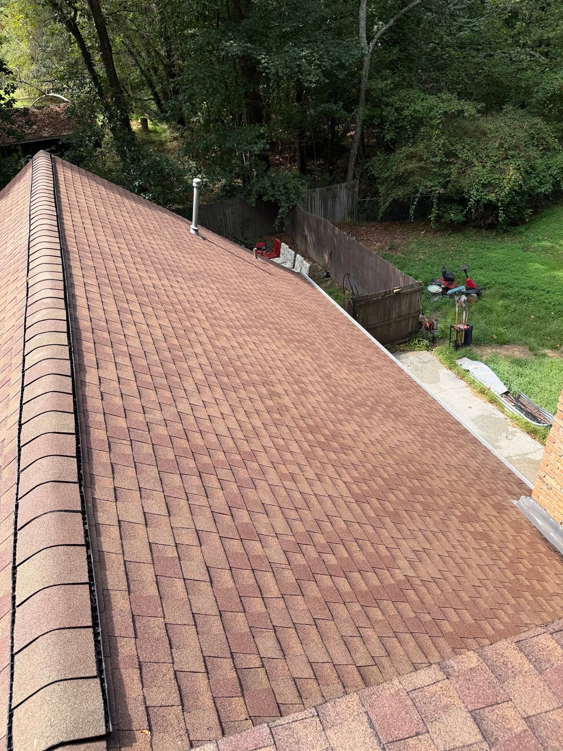 The same shingle roof section beside the chimney in Winder after washing